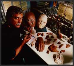 Bob Barron at a work bench with his tools and replica body parts.